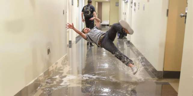 Person slipping on wet floor.
