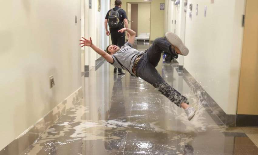 Person slipping on wet floor.