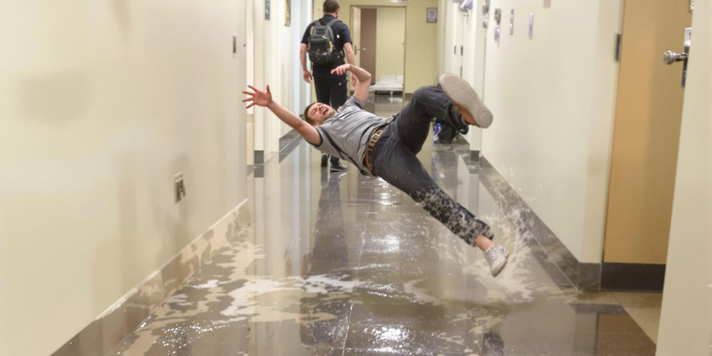 Person slipping on wet floor.