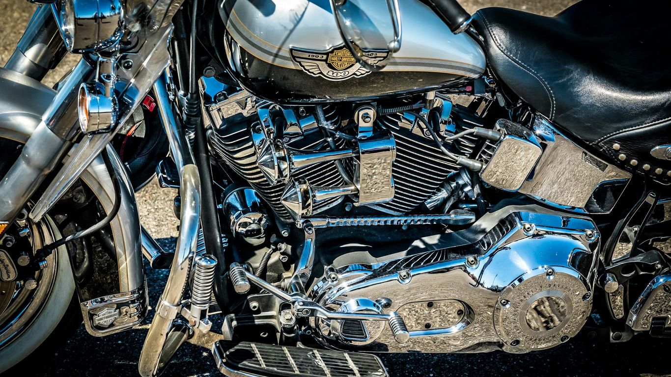 a close up of a motorcycle parked on a street