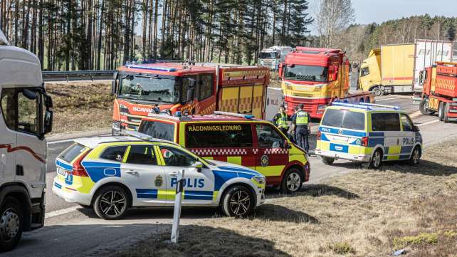Emergency vehicles responding to a traffic incident on the road.