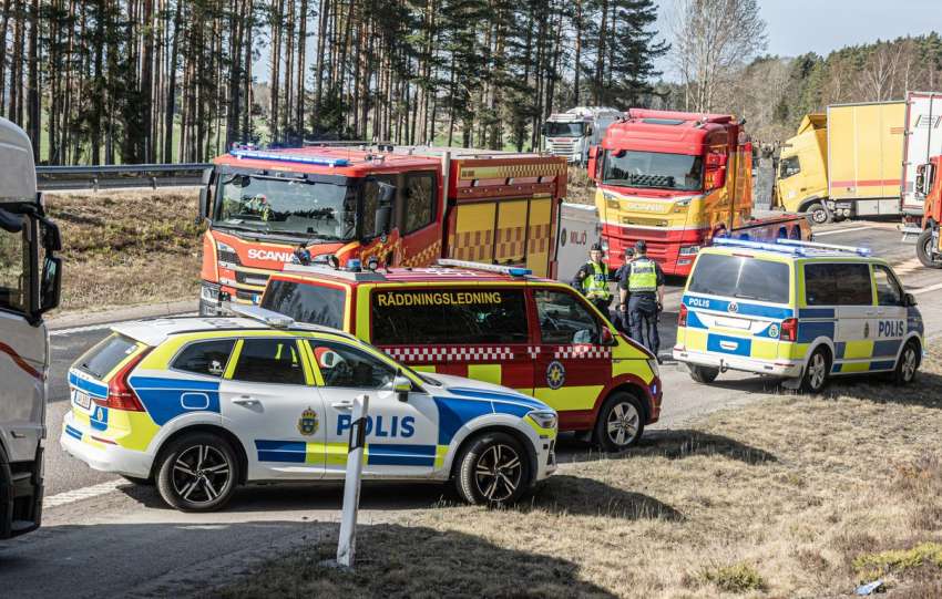 Emergency vehicles responding to a traffic incident on the road.