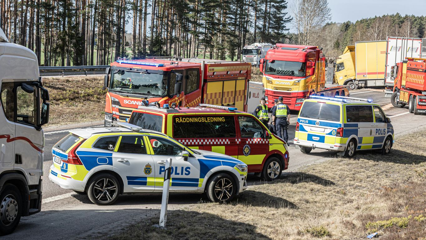 Emergency vehicles responding to a traffic incident on the road.