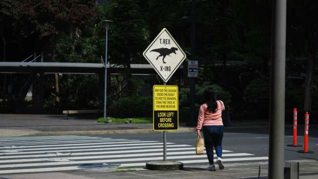 a couple of people that are standing in the street