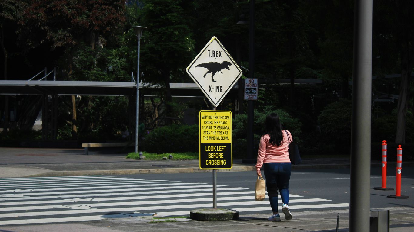 a couple of people that are standing in the street